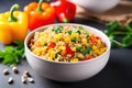 bowl of quinoa with mixed bell peppers and sweet corn