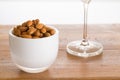 Bowl of raw almond nuts on wooden table Royalty Free Stock Photo