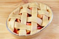Bowl of raw apple pie with decorative woven lattice top crust ready for baking Royalty Free Stock Photo