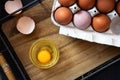 Bowl of raw egg and egg shell on a wooden tray Royalty Free Stock Photo