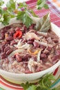 Bowl of red bean soup with sauerkraut, onions