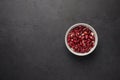 Bowl of red beans on a textured wooden black background. Vegetable protein healthy food Royalty Free Stock Photo