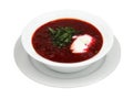 Bowl of red beetroot soup borsch on white round plate. Isolated Royalty Free Stock Photo