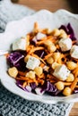 Bowl of red cabbage carrots chickpeas and diced cheese Royalty Free Stock Photo