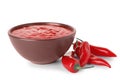 Bowl with red sauce and fresh chili peppers isolated Royalty Free Stock Photo