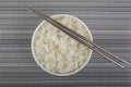 Bowl of rice with chopsticks isolated on white background Royalty Free Stock Photo