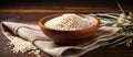 Dish A bowl of rice rests on a napkin on a wooden table Royalty Free Stock Photo
