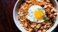 a bowl of rice with a fried egg and peanuts