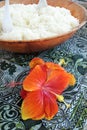 Bowl of rice served with red hibiscus flower decoration in Rarotonga Cook Islands