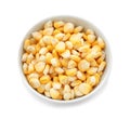 Bowl with ripe corn kernels on white background Royalty Free Stock Photo