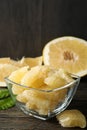 Bowl with ripe pomelo fruit slices on wooden table Royalty Free Stock Photo