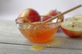 Bowl rustic honey and apples on wooden table. Traditional celebration food for the Jewish New Year. Concept Rosh Hashana. Royalty Free Stock Photo