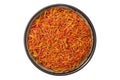 Bowl of Saffron seasoning closeup. Organic Saffron or alternative to saffron - Safflower spice in bowl, isolated on white.