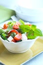 Bowl of salad with feta and green olives