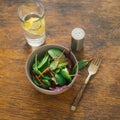 Vegetarian biodynamic food. Bowl salad spinach, beet leaves, water, lemon