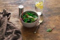 Vegetarian biodynamic food. Bowl salad spinach, beet leaves, water, lemon