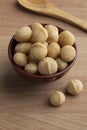 Bowl with salted macadamia nuts close up Royalty Free Stock Photo