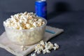 Bowl with salted popcorn on a black table, selective focus Royalty Free Stock Photo