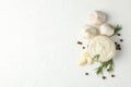 Bowl of sauce, garlic bulbs, slices, spice, rosemary on white background, top view