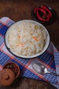 Bowl of sauerkraut, sour pickled cabbage and carrots with hot chilli red pepper and spices. Piquant salad with vitamin C from