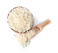 Bowl and scoop with uncooked long grain rice on white background