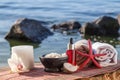 Bowl with sea salt, bottles with aromatic oil, candle, orchid fl