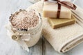 Bowl of sea salt, towel and two bars of handmade soap