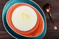 Bowl of semolina porridge with butter on dark wooden background close up Royalty Free Stock Photo