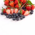 A bowl set of beautiful and delicious strawberry and blueberry isolated on white background, close up, copy space, clipping path, Royalty Free Stock Photo