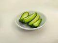 a bowl of several pieces of boiled chayote on a white background