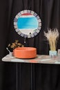 Bowl-shaped concrete sink, orange cement sink, black faucet, wall mirror, original bathroom