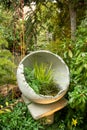A bowl shaped garden decoration.