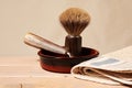 Bowl with shaving equipment, blade, brush and towel on the table in the bathroom Royalty Free Stock Photo