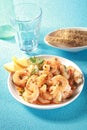 Bowl of shelled grilled pink prawns