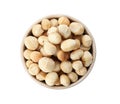 Bowl with shelled organic Macadamia nuts on white background Royalty Free Stock Photo