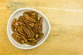 Bowl with shelled pecan nuts. View from above. Royalty Free Stock Photo