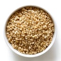 Bowl of short grain brown rice on white.