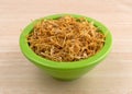 Bowl of shredded calendula flower petals on table