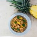 A bowl of shrimp and pineapple fried rice