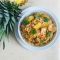 A bowl of shrimp and pineapple fried rice
