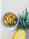 A bowl of shrimp and pineapple fried rice