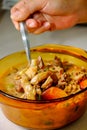 A bowl of Soto Betawi, Indonesian native traditional soup made of beef or beef offal cooked in coconut milk broth