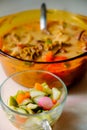 A bowl of Soto Betawi, Indonesian native traditional soup made of beef or beef offal cooked in coconut milk broth with pickles