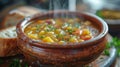 Bowl of Soup and Bagel on Table Royalty Free Stock Photo