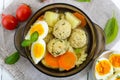 A bowl of soup with chicken meat balls, vegetables, boiled egg and fusilli. Royalty Free Stock Photo