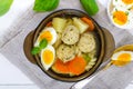 A bowl of soup with chicken meat balls, vegetables, boiled egg and fusilli. Royalty Free Stock Photo