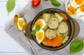 A bowl of soup with chicken meat balls, vegetables, boiled egg and fusilli. Royalty Free Stock Photo