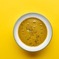 Bowl soup with pea sprouts , on a yellow background. Flat lay with copy space. Square image Royalty Free Stock Photo