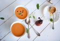 Bowl of soup with pumpkin on white wooden table Royalty Free Stock Photo