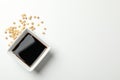 Bowl of soy sauce, soy beans on background, space for text. Top view Royalty Free Stock Photo